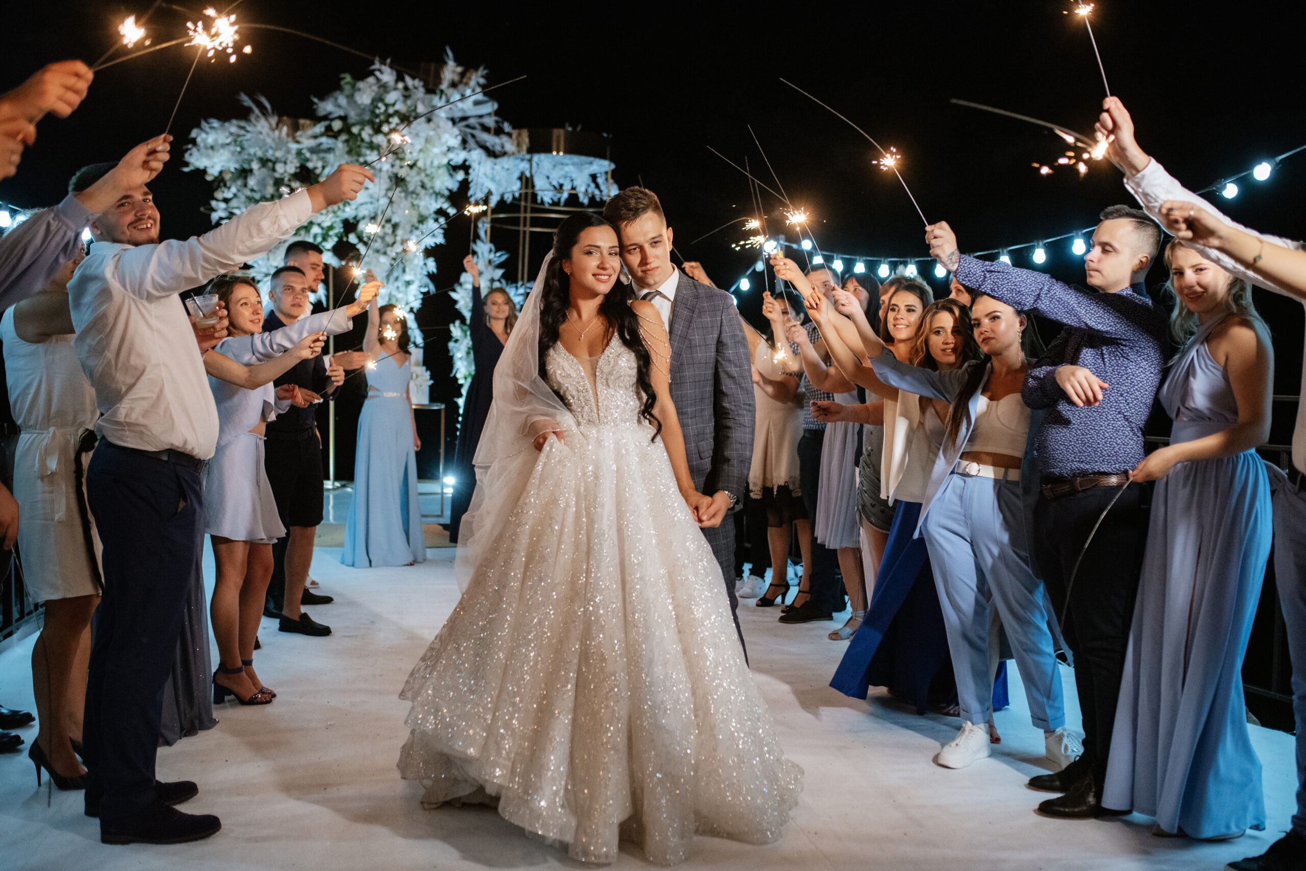 newlyweds at a wedding of sparklers